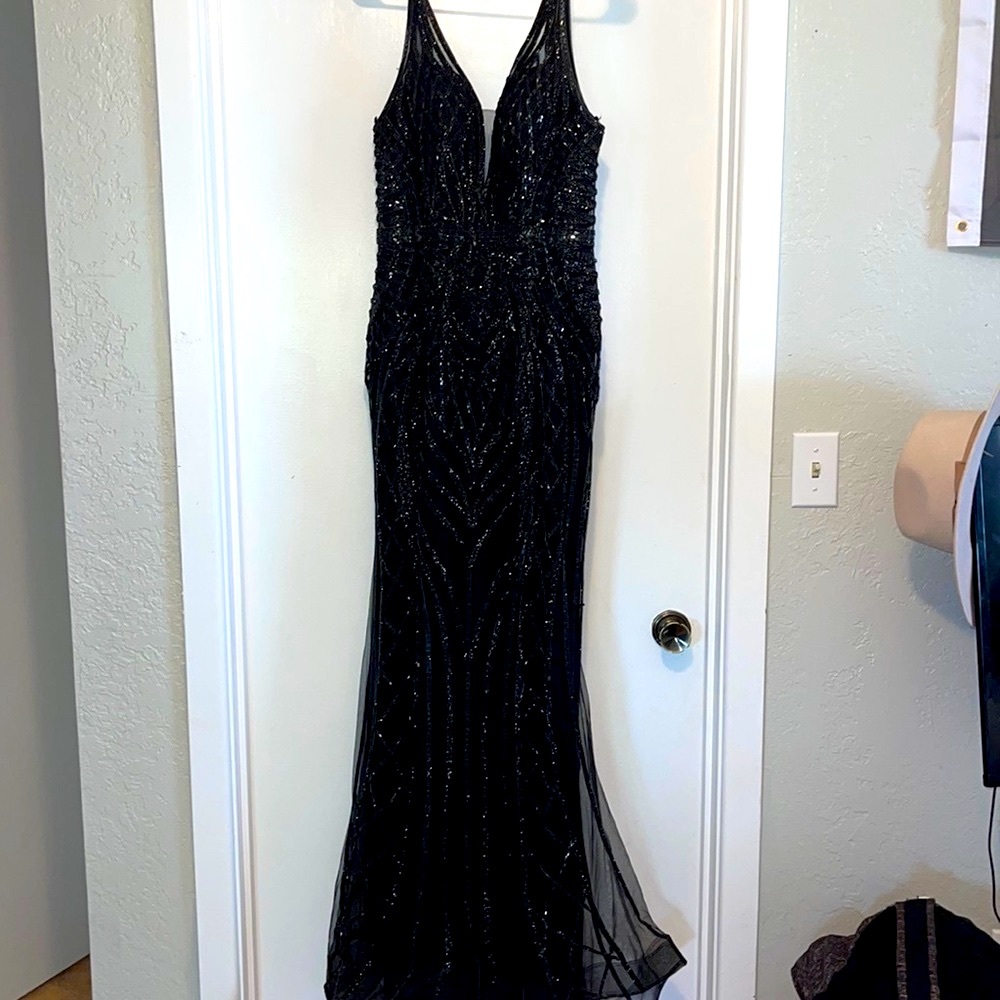 Prom dress worn once. Black sequin mermaid style dress. Open back with zipper